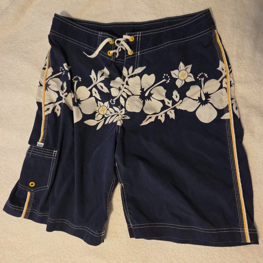 Like new Hurley mens boardshorts, Med (34), navy with yellow and white floral